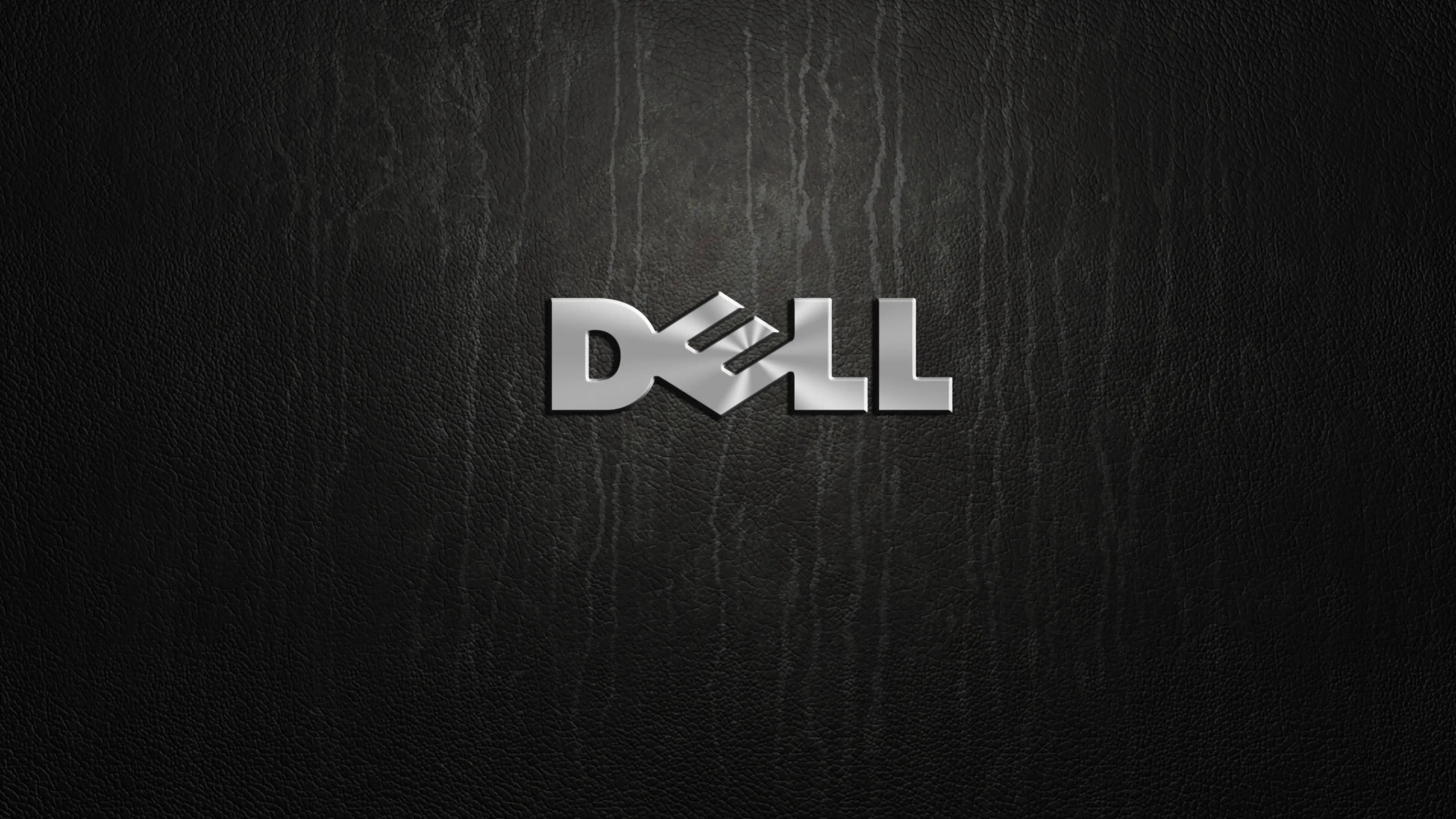 나무 배경 위의 Dell 4K 로고 배경화면