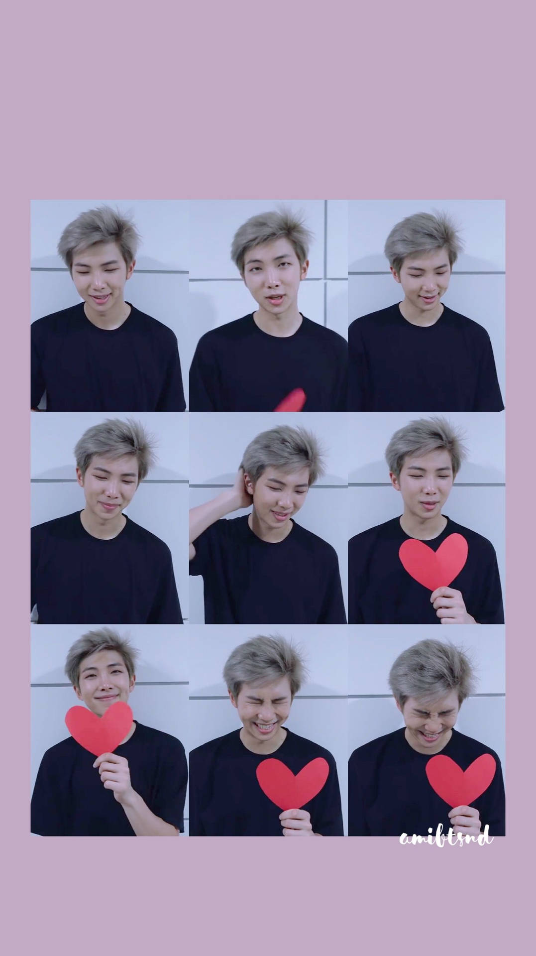 종이로 오린 하트를 들고 있는 분홍색의 BTS 멤버