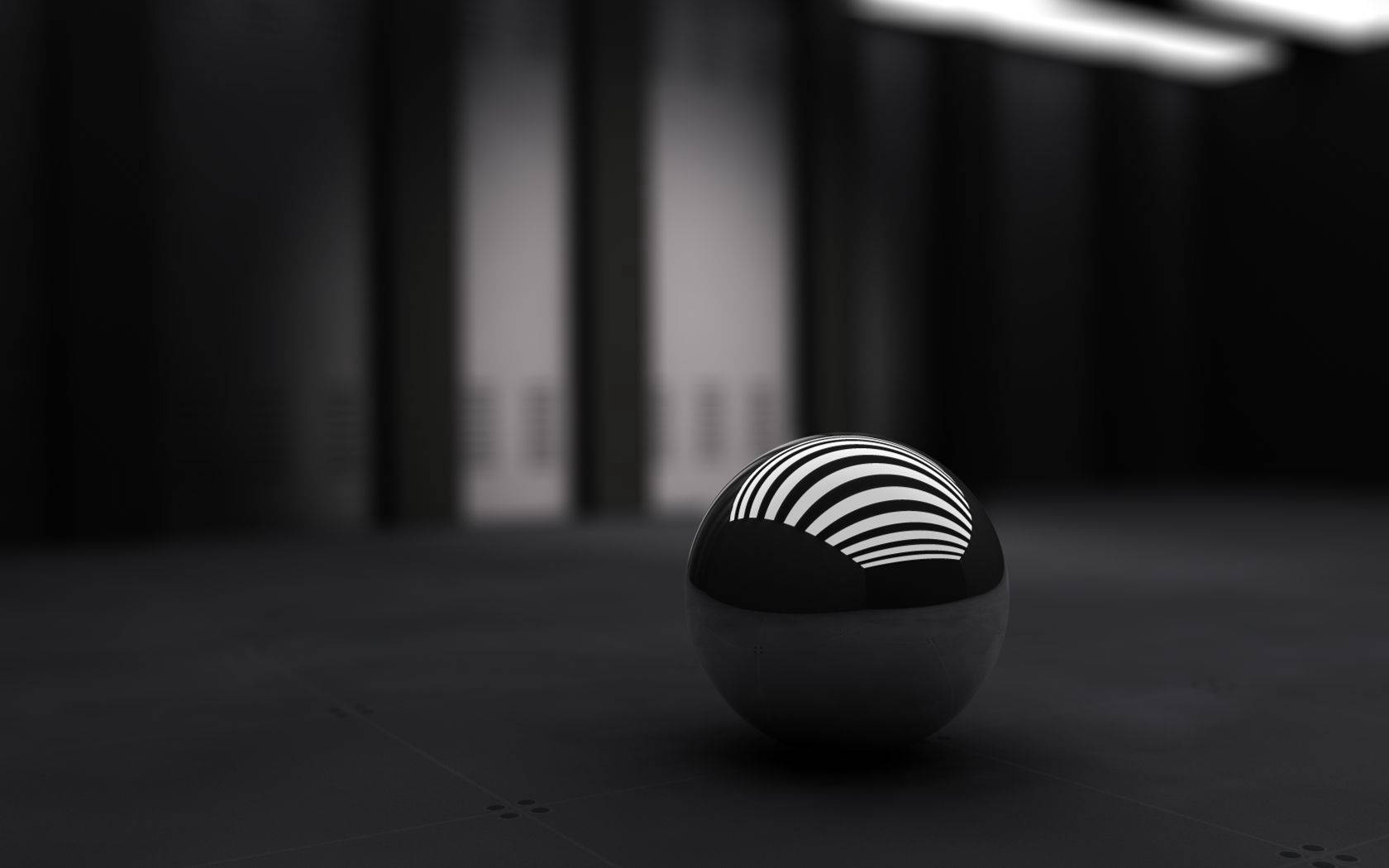 작은 검은 구체의 3D 데스크탑 배경화면.