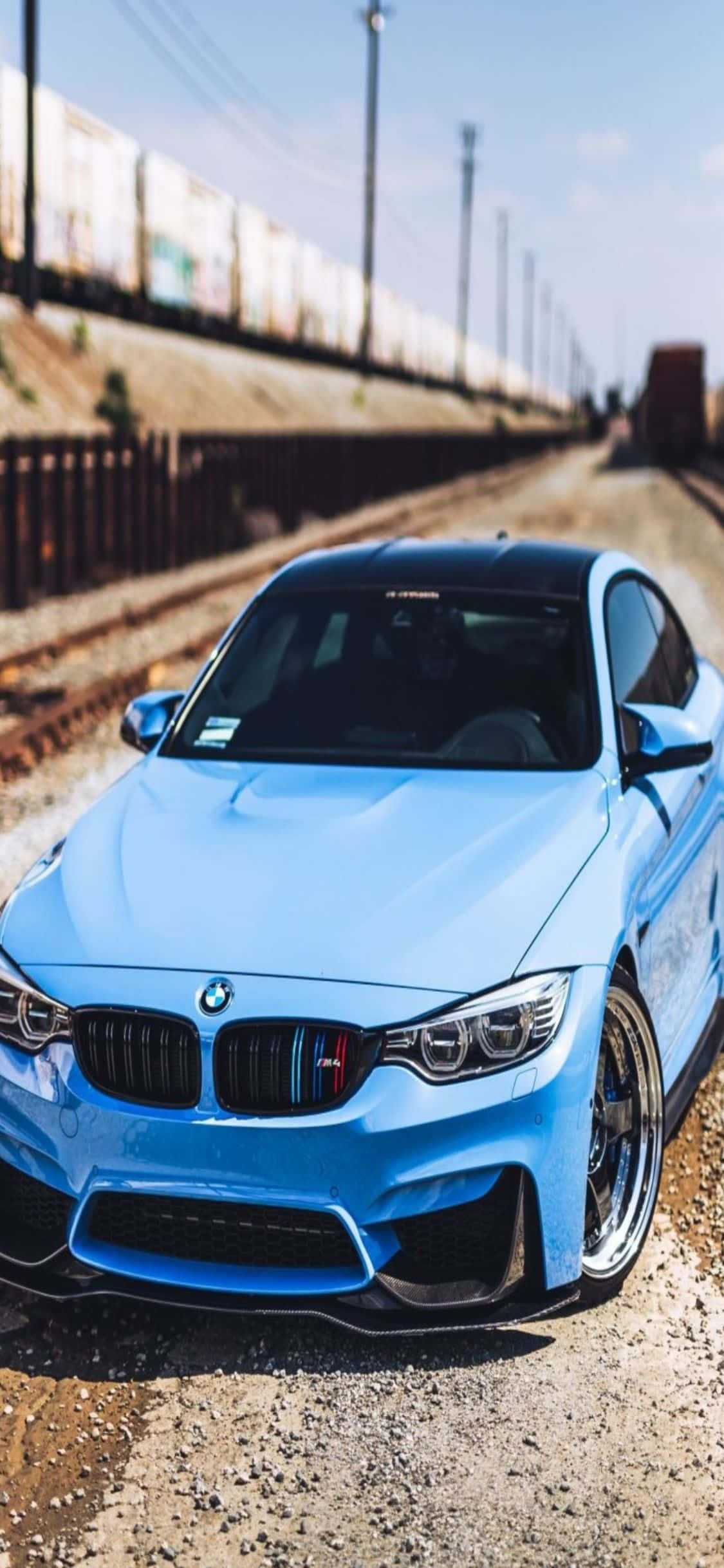 첨단 기술과 고급스러움. 아이폰 X와 세련된 BMW가 함께. 배경화면