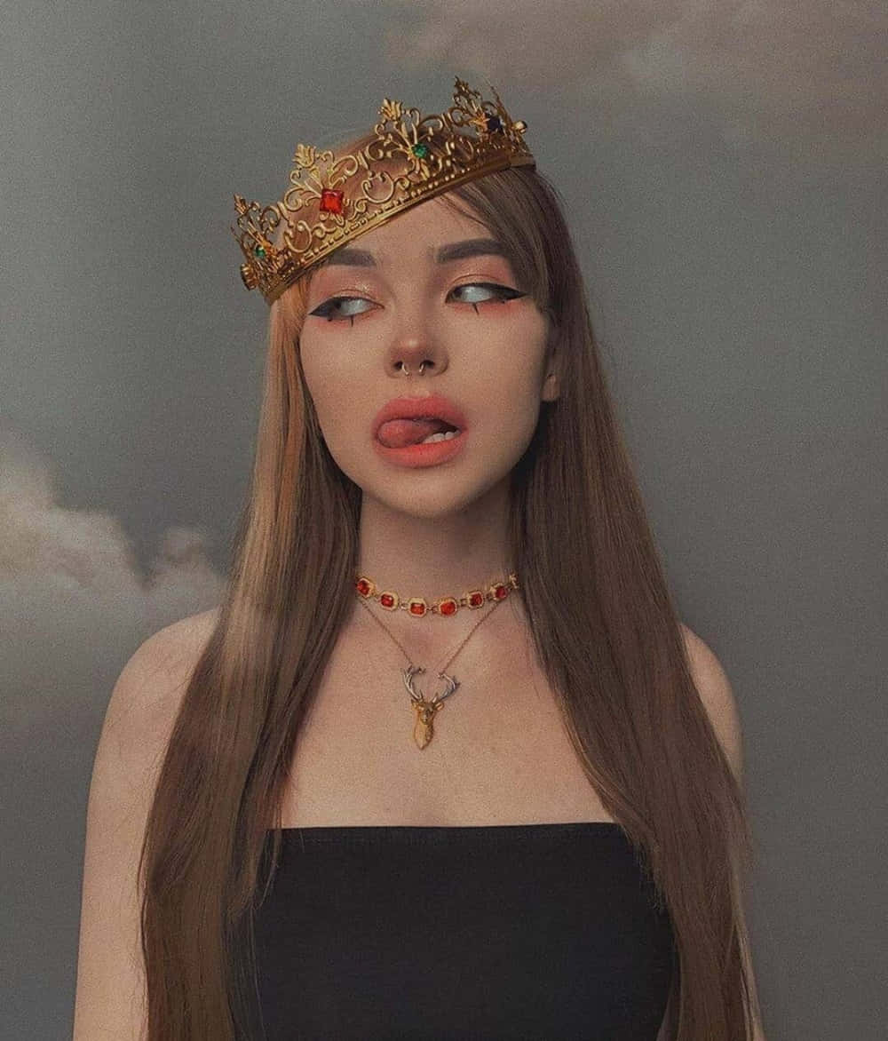 평화로운 초원에 앉아 예술적 영혼을 품은 젊은 여성 배경화면