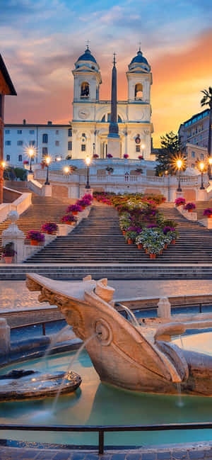 로마 스페인 계단의 숨 막히는 일몰 — 아이폰 15 플러스 배경화면